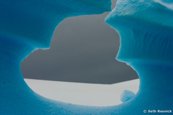 Iceberg with hole, Antarctica
